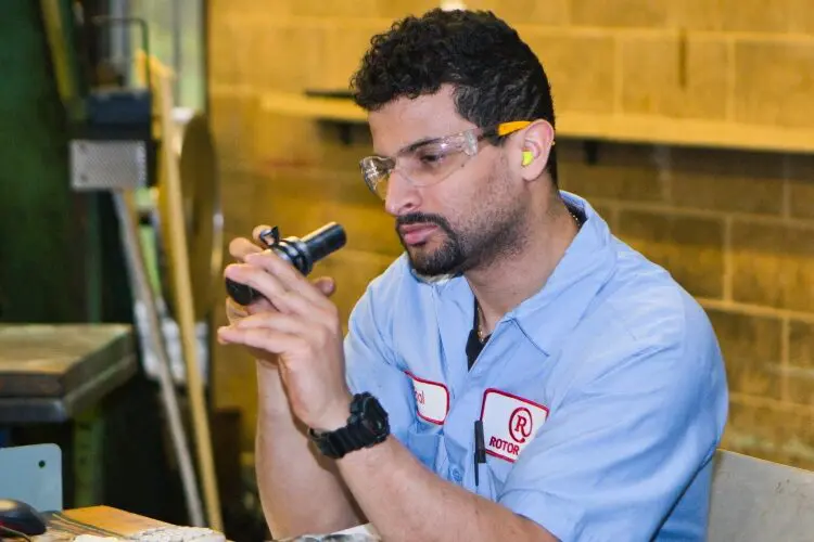 Rotor Clip employee inspecting a product