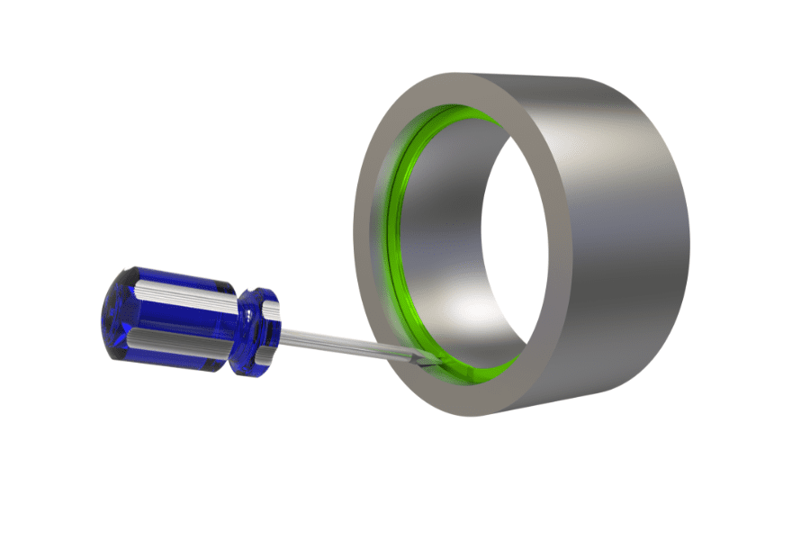 screwdriver being used to remove a 2 turn spiral ring
