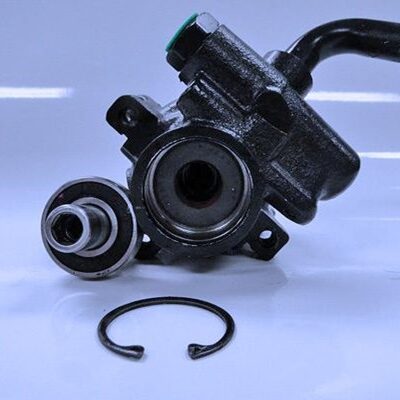 The power steering pump, bearing, and retaining ring can be removed for easy assembly/disassembly of the pump.