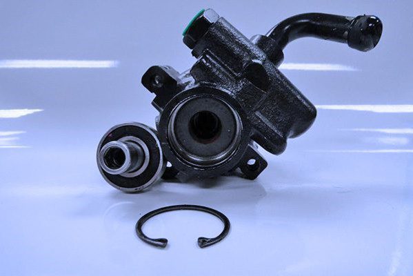 The power steering pump, bearing, and retaining ring can be removed for easy assembly/disassembly of the pump. 