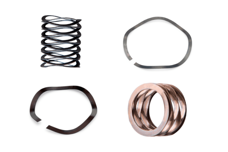 Assortment of wave springs in diverse materials, highlighting their adaptability to different environmental and operational requirements