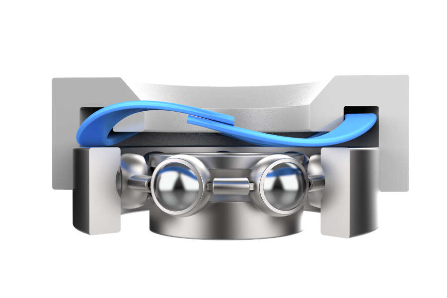 An illustration of a single-turn wave spring used in a bearing preload application, applying controlled axial force to maintain consistent contact between bearing components. The compact spring design helps reduce internal clearance, vibration, and noise in bearing assemblies.