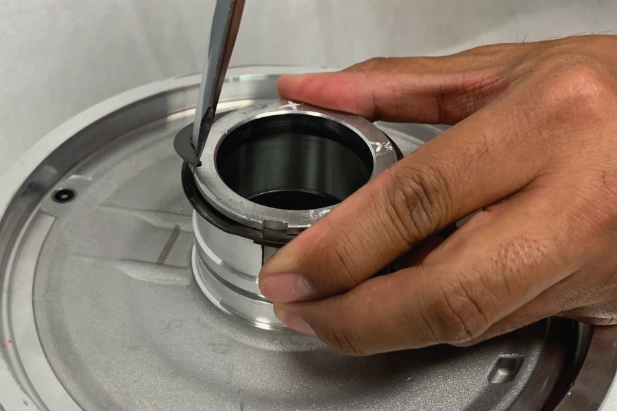 Seating the final turn of a spiral retaining ring